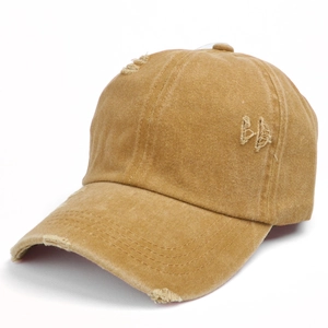Detail of vintage washed khaki baseball cap showing distressed holes and BA embroidery