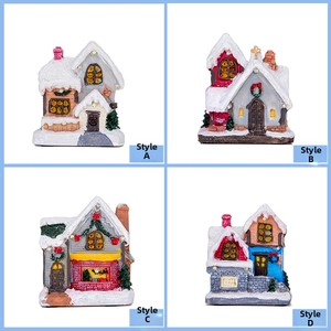 Detail view of four miniature Christmas snow house styles with resin festive decorations