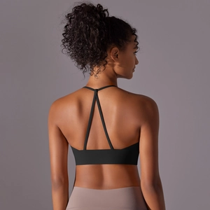 Detail view of the criss-cross back straps on a black brushed nylon sports bra
