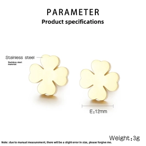 Macro detail of 12mm gold clover stud earrings in polished stainless steel