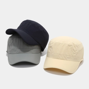 Flat top cadet caps in navy, grey, and beige shown in a clean stacked product display