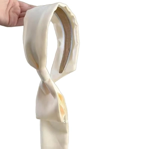 Elegant off-white satin headband with long ribbon streamers for a vintage French aesthetic