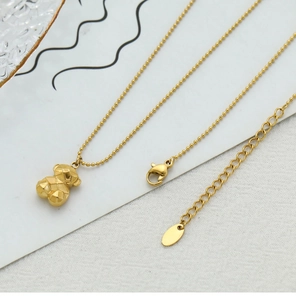 Detailed close-up of 3D geometric bear pendant with bead chain and lobster clasp