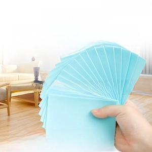 Dissolvable cleaning sheets for tile and wood floors showing rapid water solubility