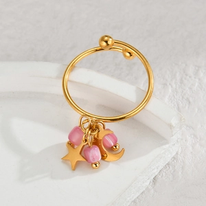 Bohemian gold adjustable ring featuring star and moon charms with pink stone beads