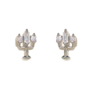 Close-up of rose gold candle earrings featuring micro-pave cubic zirconia and silver pins