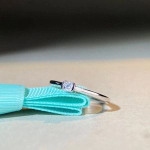 S925 sterling silver ring with princess cut moissanite diamond and teal ribbon