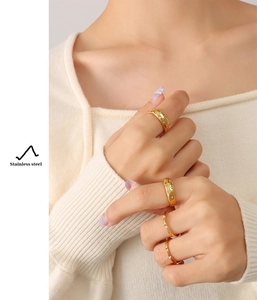 Chic 18K gold plated stainless steel rings with starry zircon inlay worn by a model