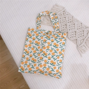 Mini sac cabas en toile avec motif floral d'orange et bouton pression métallique