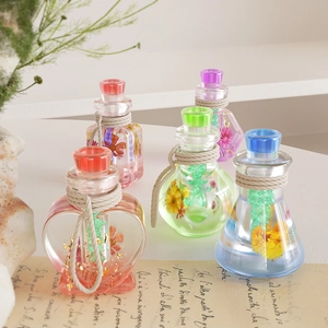 Macro shot of assorted dry flower drifting bottles with vintage braided twine accents