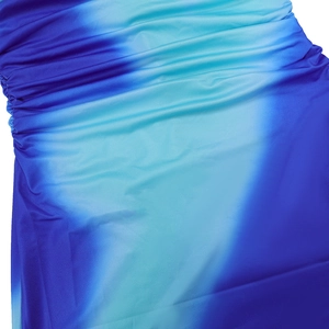 Close-up of ruched fabric detail with blue gradient transition and smooth texture