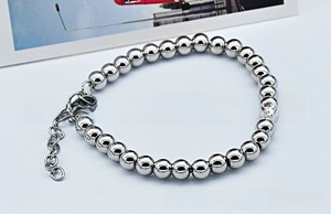 Polished silver stainless steel beaded bracelet with lobster clasp and extension chain