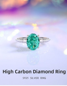 Close-up of S925 silver ring featuring an oval green carbon diamond and pave setting