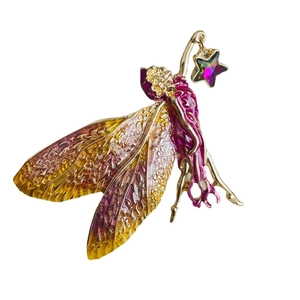 Golden fairy brooch with gradient wings holding a crystal star on a white background