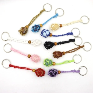 Macro shot of assorted hand-woven cord net keychains with natural raw stones and wood beads