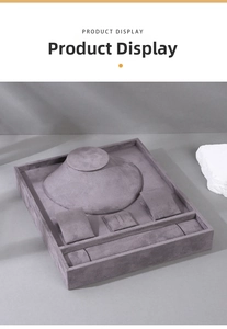 Macro view of grey velvet jewelry display stand for necklaces, rings, and bracelets