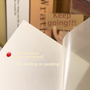 Detail of waterproof transparent sticky notes showing matte texture and strong adhesive