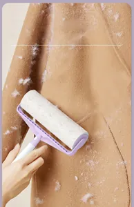 Portable lint roller removing hair and debris from a camel wool coat effectively