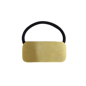 Minimalist black elastic hair tie with a brushed rectangular golden metal plate ornament