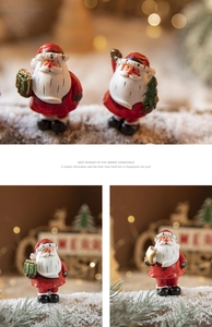 Detailed view of hand-painted resin Santa Claus figurines for Christmas tabletop decor