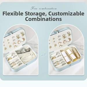 Flexible storage jewelry box with ring slots and watch compartments in light blue