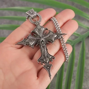 Gothic silver skull cross pendant necklace featuring Live Lost engravings in hand