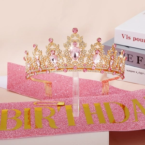 Detailed set of gold Birthday Queen crown with pink rhinestones and glitter sash