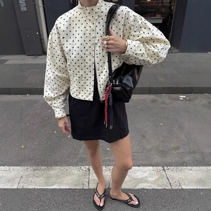 Polka dot puff sleeve bomber jacket with high neck zipper on beige base for women