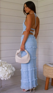 Detail view of the light blue sleeveless chiffon set with tiered maxi skirt and pleated texture