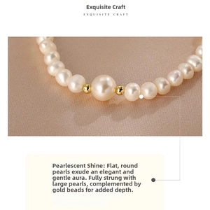 Macro shot of freshwater pearls featuring gold spacers on a textured fabric background