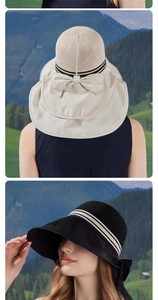 Detail of wide brim sun hat with decorative black ribbon and bow for outdoor UV protection