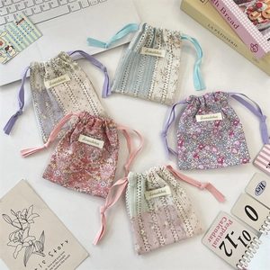 Floral and lace fabric drawstring organizer pouches for cosmetics and travel storage