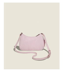 Detail view of pink crescent shoulder bag featuring adjustable strap and smooth nylon fabric