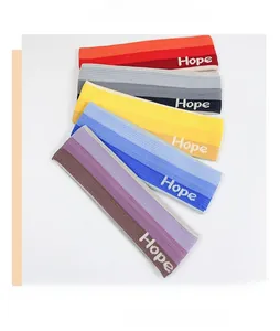 Macro view of five striped knitted headbands with Hope logo for fitness and running