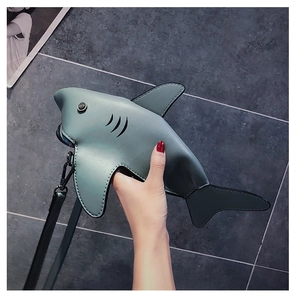 Detail of mini shark-shaped crossbody bag in matte grey-blue PU leather
