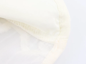 Detailed macro shot of fine mesh fabric with high-quality finished seam and sewing edges