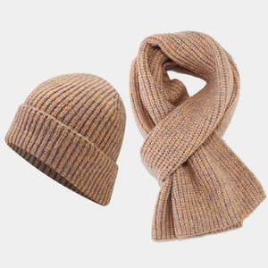 Close-up of thick ribbed knit texture on camel winter beanie and scarf set