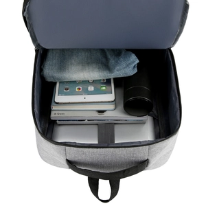 Top view of spacious grey business backpack with organized laptop and tablet compartments