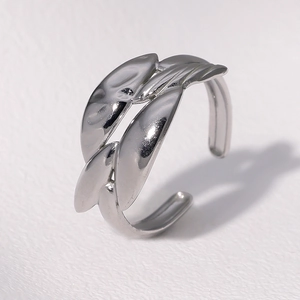 Minimalist silver leaf design open adjustable stainless steel ring on white background