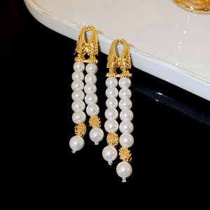 Elegant gold double tassel earrings with faux pearls and hollow metal spheres
