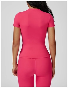 Rear view of a hot pink quick-dry yoga set featuring tight short-sleeve shirt and leggings