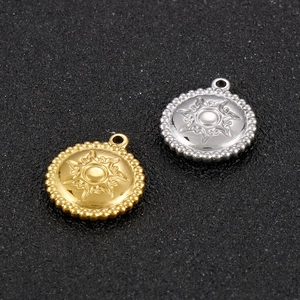 Polished stainless steel round sunburst pendants in gold and silver finish with beaded edges
