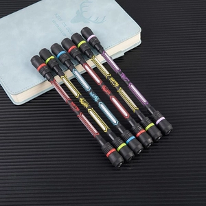 Set of six colorful spinning pens for beginners on notebook with weighted balance design