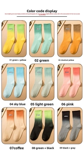 Grid view of gradient crew socks in nine colors featuring aurora letter embroidery