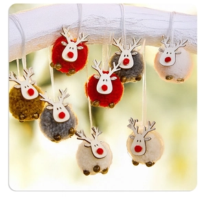 Hanging Christmas reindeer ornaments made of felt and wood with festive gold bells