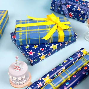Blue neon gift wrapping paper rolls with yellow ribbon and star pattern decoration