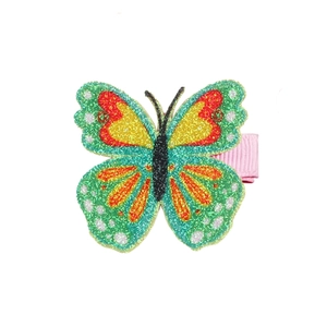 Close-up of glittery butterfly hair clip with colorful wings and pink ribbon wrapped base