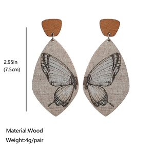 Boucles d'oreilles bohèmes ailes de papillon en bois avec détails de dimensions