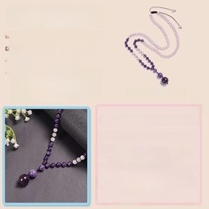 Macro detail of natural amethyst and rose quartz beads on an adjustable cord necklace
