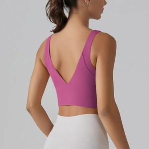 Detail view of the deep V-back design on this rose pink high-stretch sports bra